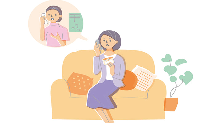 電話で病院に連絡する女性のイラスト